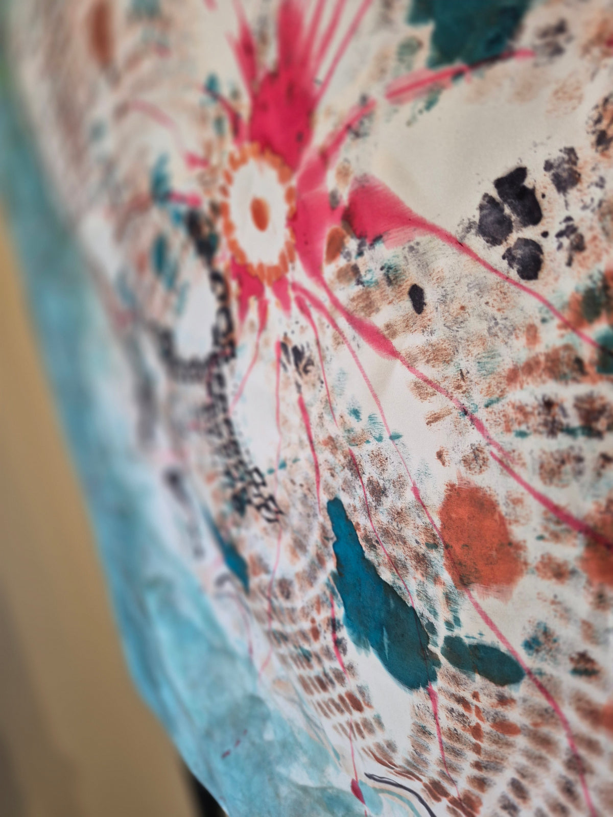 Hand-painted Mulberry silk scarf up close with red, white, turquoise, black and teal